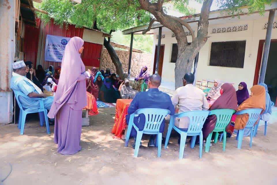A community dialogue session held outdoors