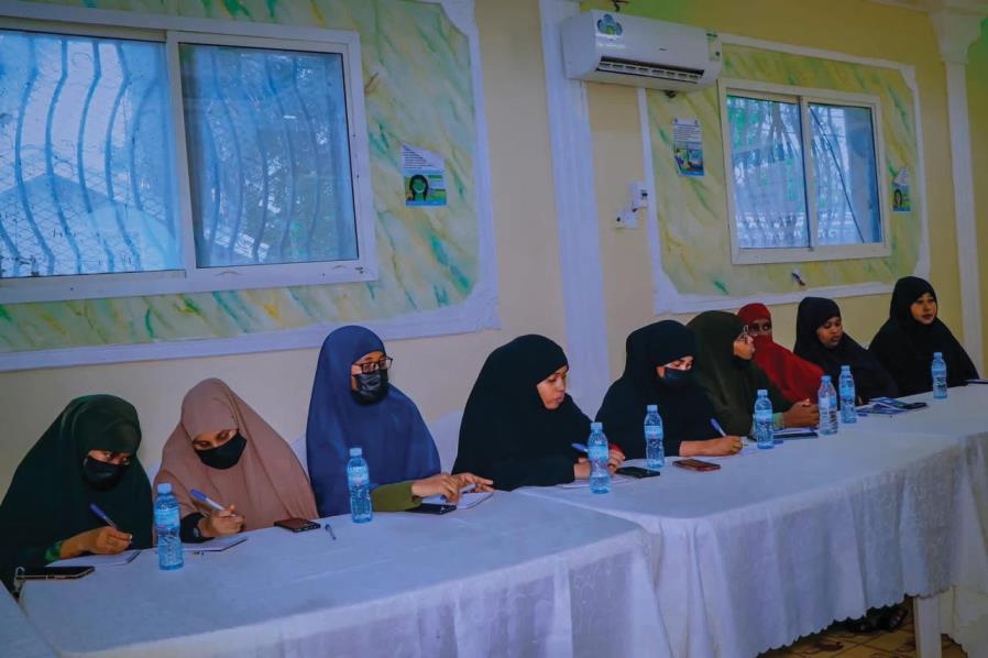 Women taking notes during a training session